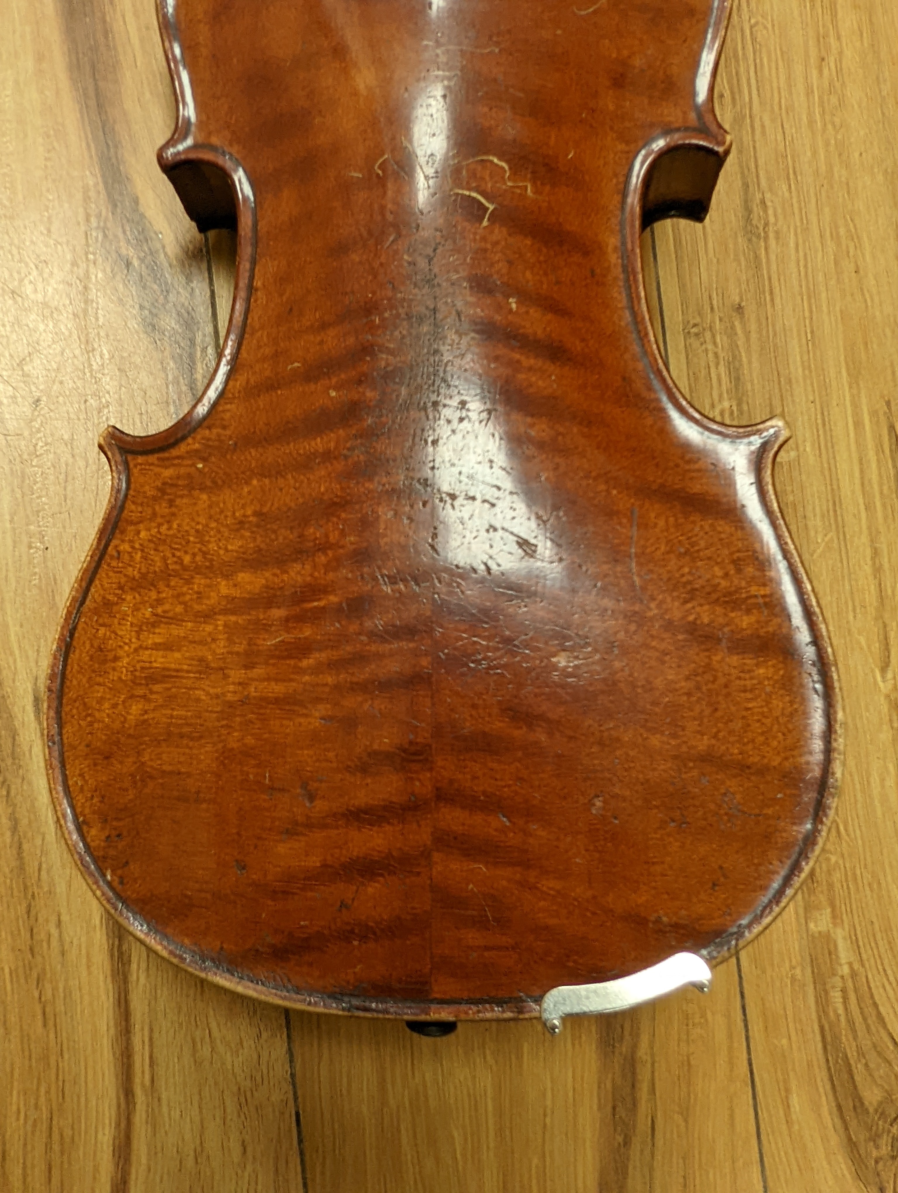 An early 20th century French vioilin, cased with bow and a cased saxon violin